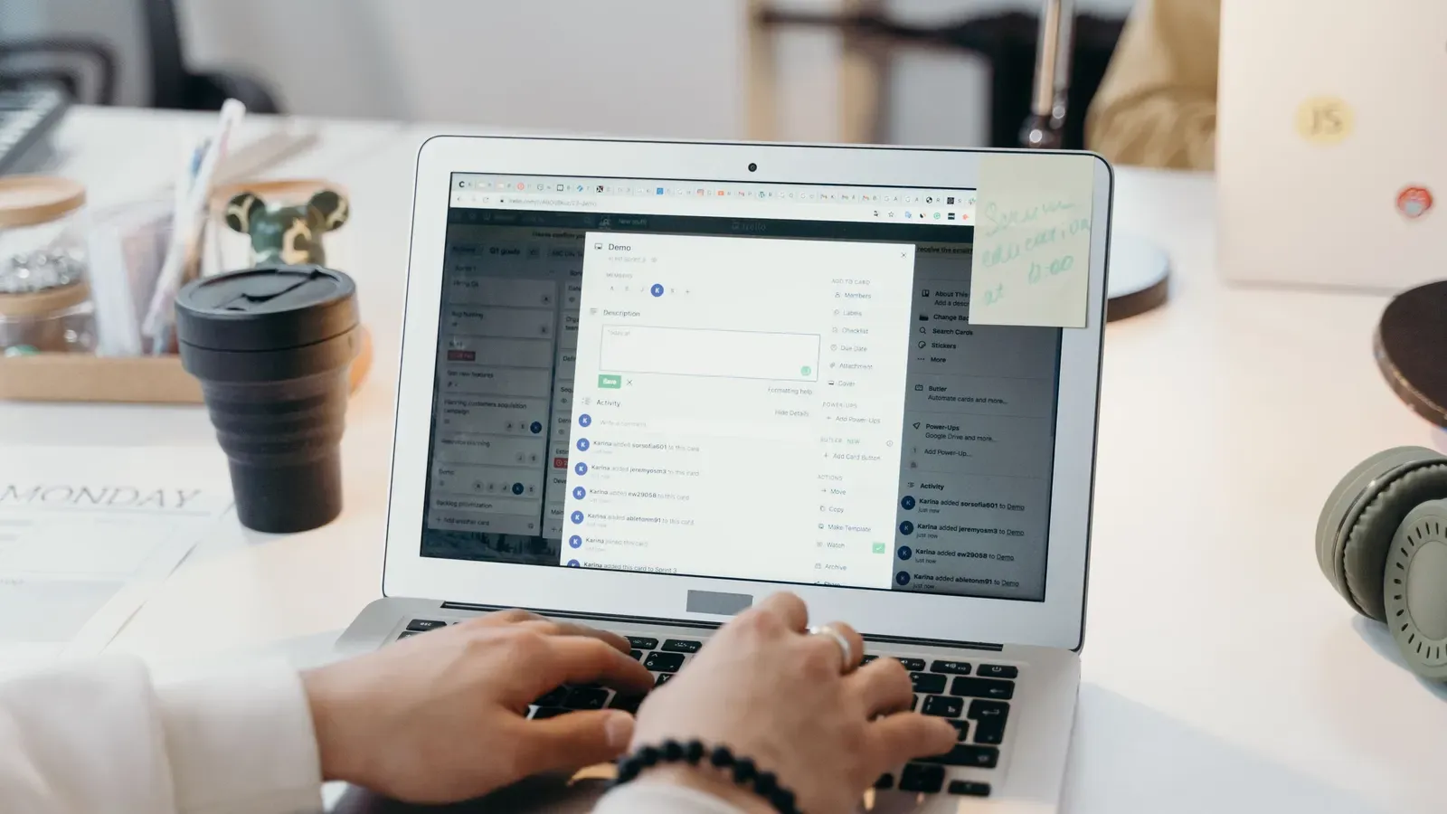 Hands typing on a laptop with an email inbox open