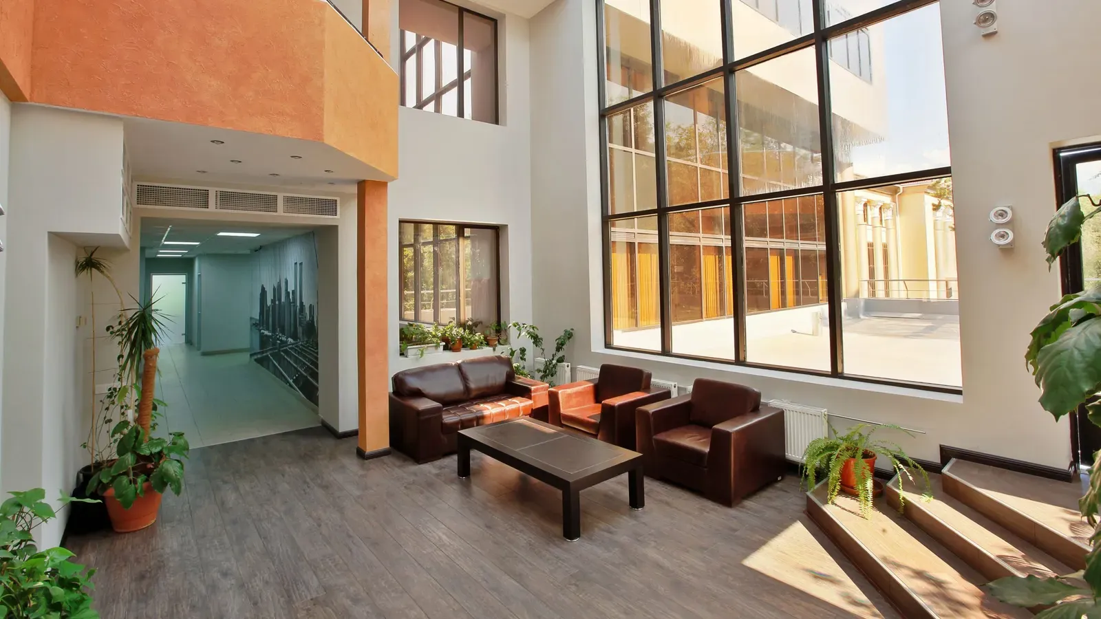 A bright, modern office lobby with seating