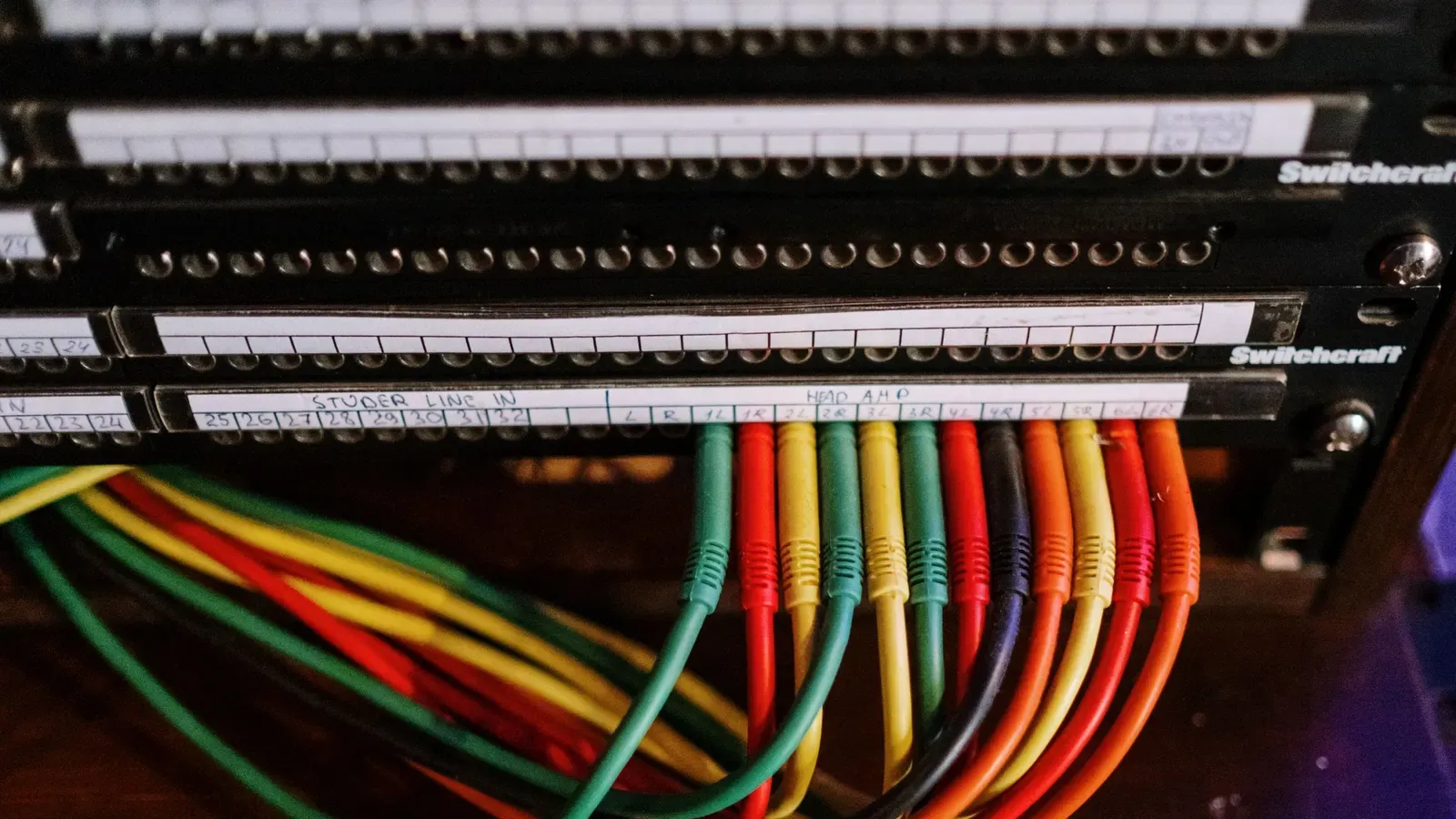 A patch panel with neatly organized color-coded network cables